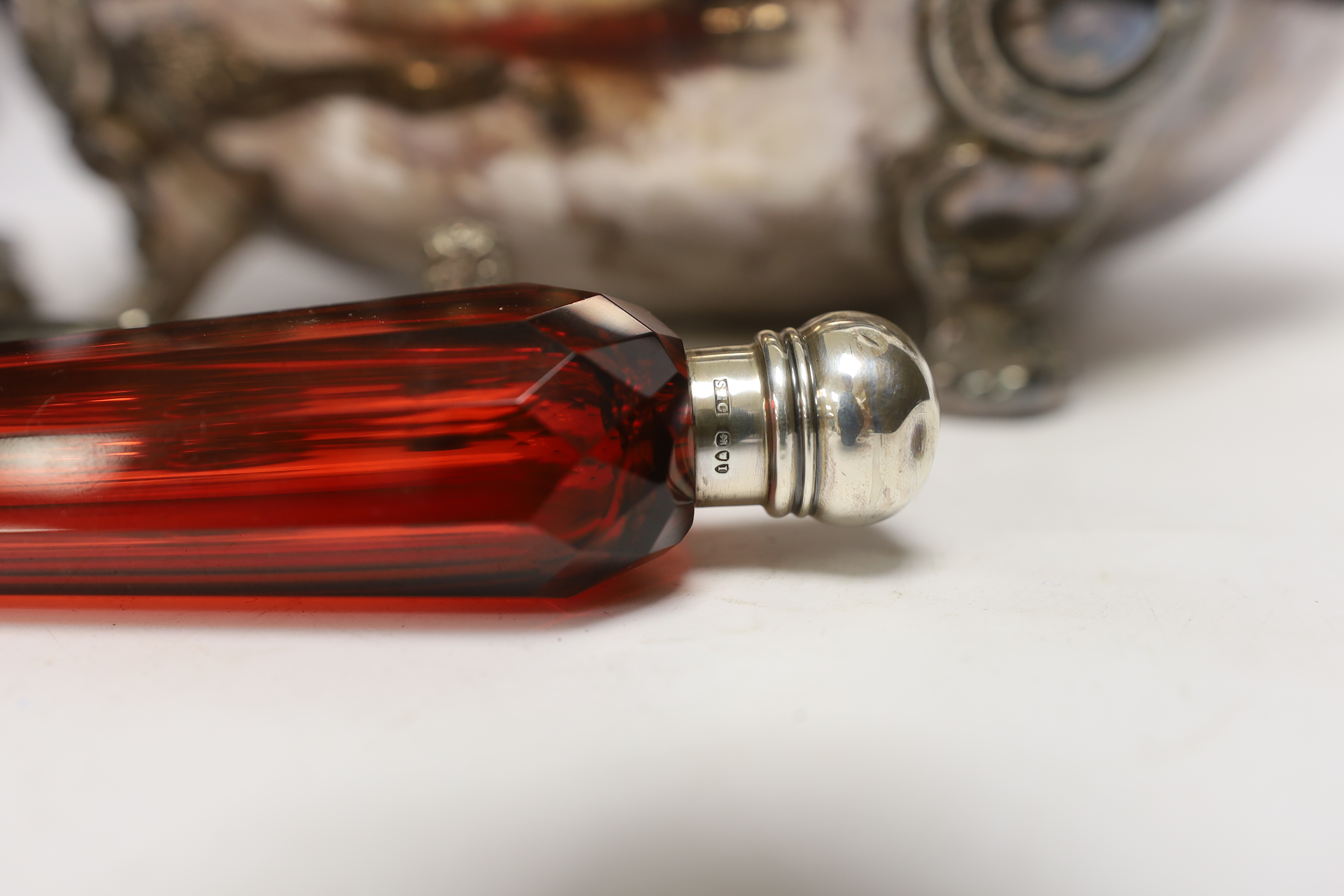A Victorian red glass and sliver topped perfume bottle, 23cm long, a miniature blue glass silver topped bottle, together with a plated hand mirror and a tureen and cover